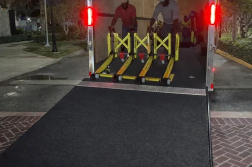 A team deploying connected MVB3X barriers down the ReadyLink trailer ramp